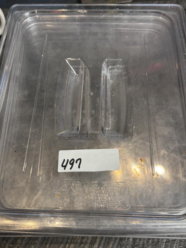 Cambro 1/2 Size Plastic Lid, clear, slight wear, label with "497" visible, set of 5 available for bid.