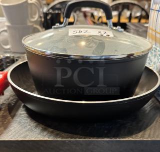 Tramontina 10" frying pan and 2.75 qt. sauce pan with lid, black non-stick, new condition, visible label "502".