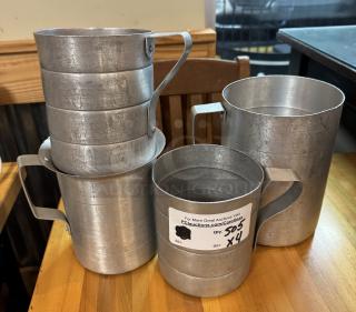 Assorted metal measuring cups, 2 and 4 qt sizes, worn condition, visible auction label with quantity and bid details.