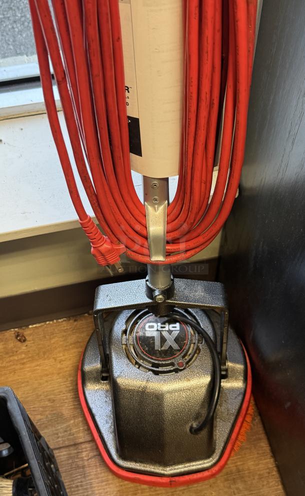 Oreck XL Pro Scrubbing Machine with Attachments; tested and working. Features red power cord and durable metal body.