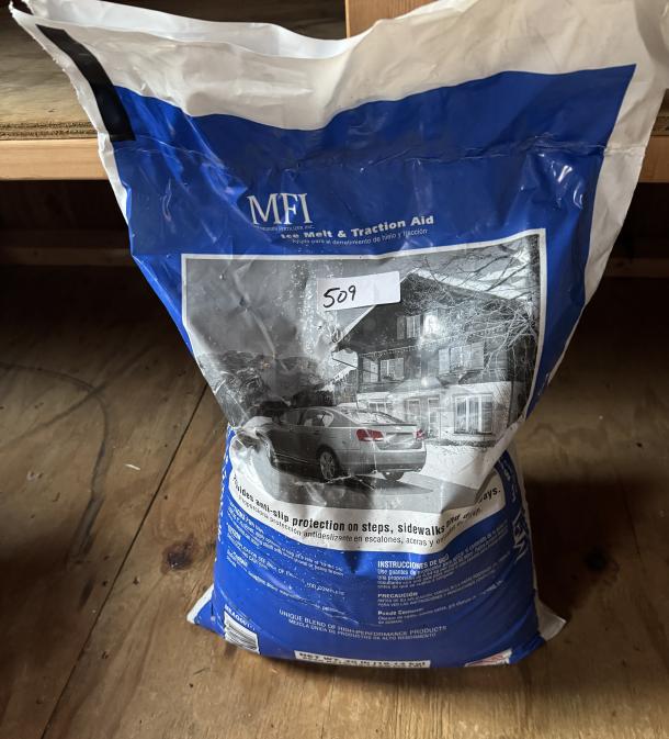 40 lb. bag of MFI Ice Melt and Traction Aid. Features protective blend, visible label for anti-slip use, moderate wear.