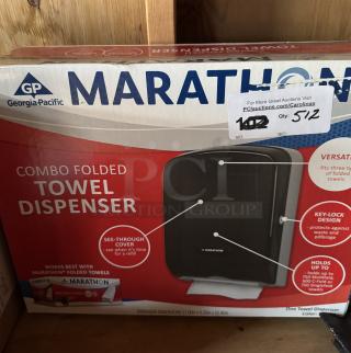 Marathon Combo Folded Towel Dispenser, new in box. Features see-through cover, key-lock design, holds up to 750 towels.