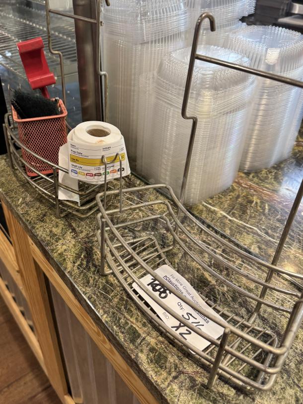 Mountable wire racks with labels for item organization. Visible tags list item type and quantity. Excellent condition.