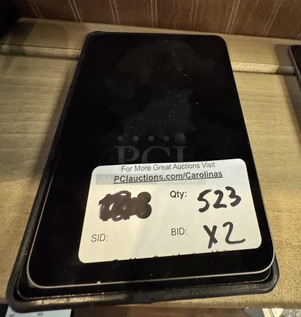 Apple iPad Mini in tested and working condition, black screen. Auction label shows quantity 523, bid x2.