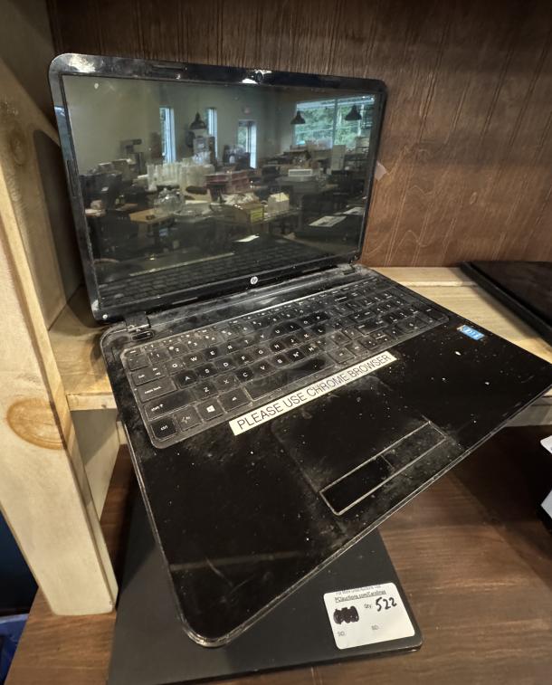 HP laptop computer, working condition, requires reset. Features a "PLEASE USE CHROME BROWSER" sticker on the keyboard.