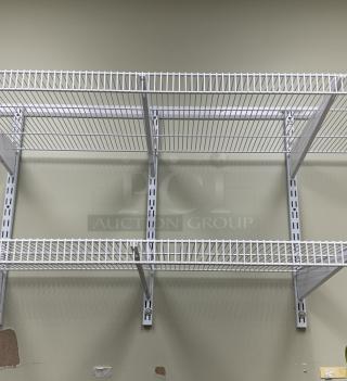 White wall-mounted wire shelving with sturdy brackets, featuring a durable design. Ideal for storage, in excellent condition.