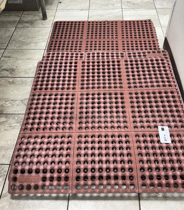 Red floor mats with circular cutouts, sizes 3'x3' and 5'x3'. Durable rubber, suitable for high-traffic areas. Marked $55 on tag.