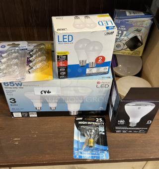 Assorted light bulbs including LED and high-intensity types, showcasing brands like GE and Utilitech, in new condition.
