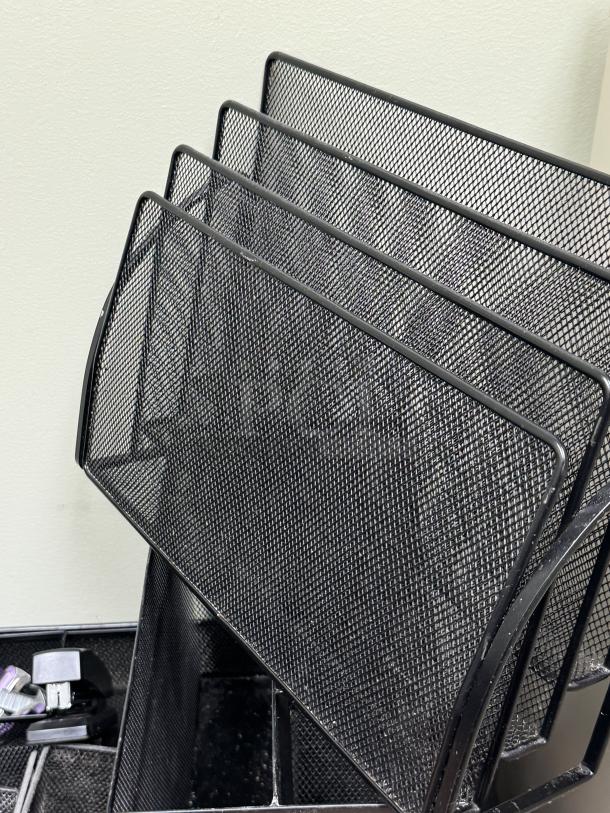 Mesh desk organizer with multiple trays and baskets, black finish, excellent condition, ideal for office use.