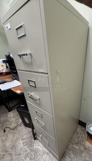 4-drawer filing cabinet, beige, metal, no key, visible label “532”, some wear, designed for office storage.