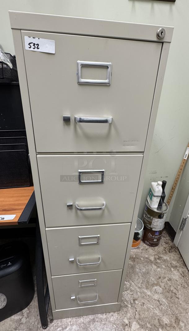 4-drawer filing cabinet, beige, no key, metal handles, label slots on each drawer, some visible wear, item tag "532".
