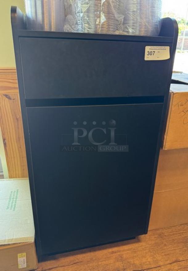 Black trash can bin, rectangular, metal, slight wear, auction tag labeled "307" on top right corner.