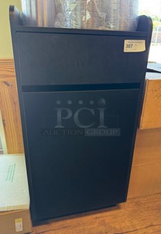 Black trash can bin, rectangular, metal, slight wear, auction tag labeled "307" on top right corner.