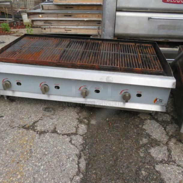 CPG Natural Gas Charbroiler, Model CRCPG48NL, 48x27x16, features adjustable knobs, used condition, visible surface wear.