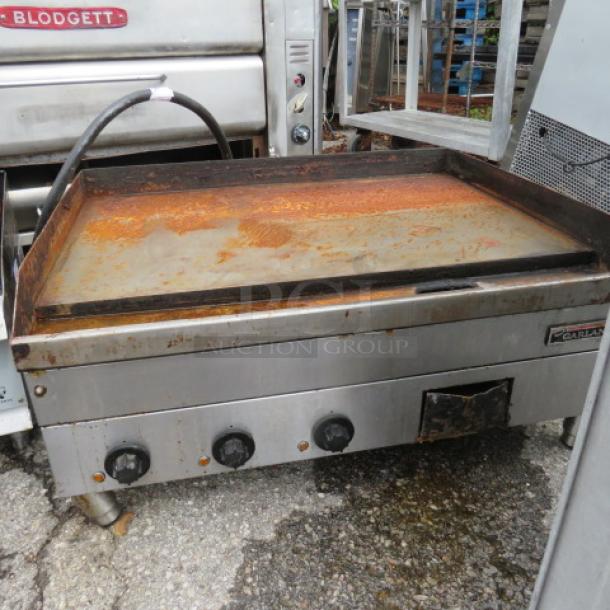 Garland Electric Griddle Model E24-36G, 208 Volt, 3 Phase, 36X30X17. Visible rust, inability to test, worn condition.