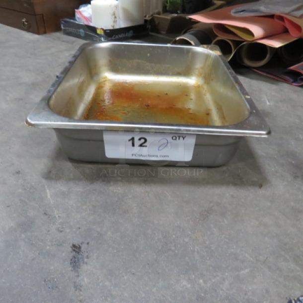 1/2 Size Hotel Pan, stainless steel, visible wear, auction tag marked "12 QTY," used condition.