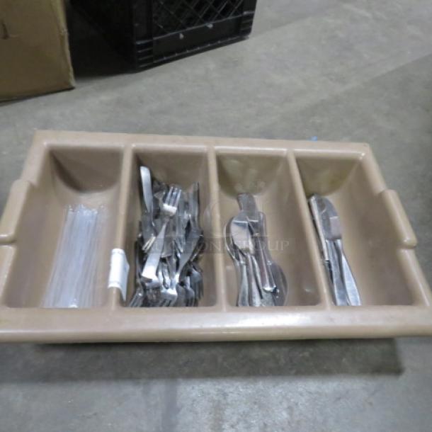 Brown flatware holder with compartments containing assorted flatware; includes forks, spoons, and knives. Used condition.