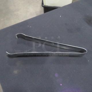 9.5-inch stainless steel tongs, model 6XBID, in good condition. Simple design, durable metal construction.