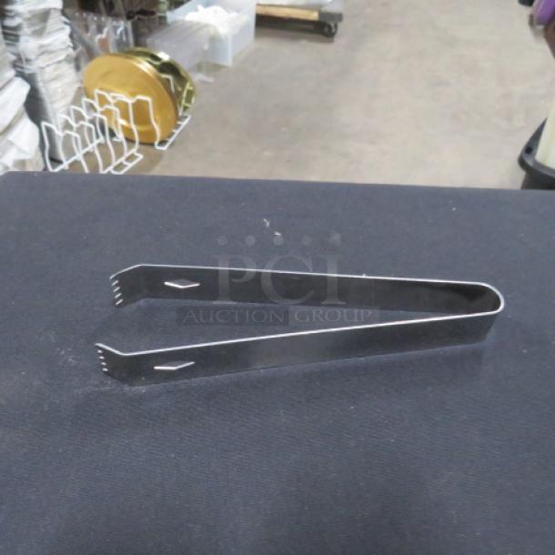 One lot of 10 stainless steel 6.5-inch tongs, shiny finish, serrated tips, excellent condition, suitable for kitchen use.