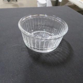Clear glass ramekin with vertical ribbed design, excellent condition, ideal for baking or serving, model 8XBID.