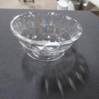 Clear glass ramekin, model 13XBID, in excellent condition. Features smooth, rounded shape ideal for baking or serving.