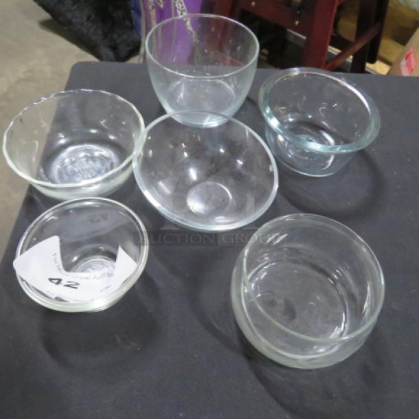 Assorted clear glass bowls, set of six, various shapes and sizes, good condition, includes auction label "42".