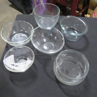 Assorted clear glass bowls, set of six, various shapes and sizes, good condition, includes auction label "42".