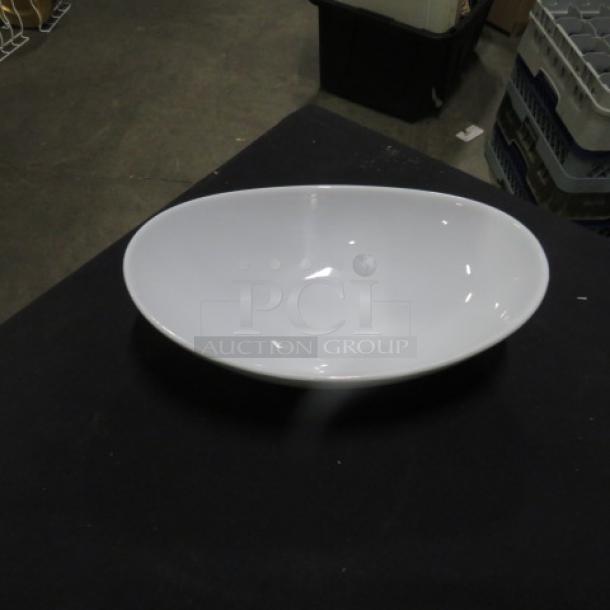 Varick 10x6.5 serving dish, white, oval shape, glossy finish. Appears to be in excellent condition.