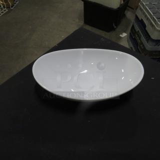 Varick 10x6.5 serving dish, white, oval shape, glossy finish. Appears to be in excellent condition.