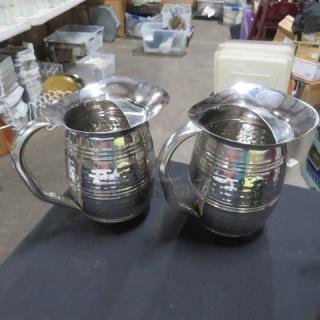 Stainless steel hammered water pitcher set, polished finish, with sturdy handles, in excellent condition.