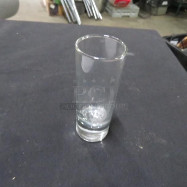 Heavy duty shot glass, clear glass, cylindrical design, sturdy base, excellent condition, no visible markings.