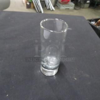 Heavy Duty Shot Glass, 10XBID model. Clear glass, cylindrical shape. Good condition, thick base for stability.