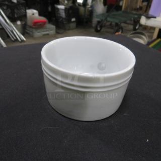 White ceramic ramekin, 8XBID, glossy finish, excellent condition, no visible marks or damage, suitable for baking or serving.