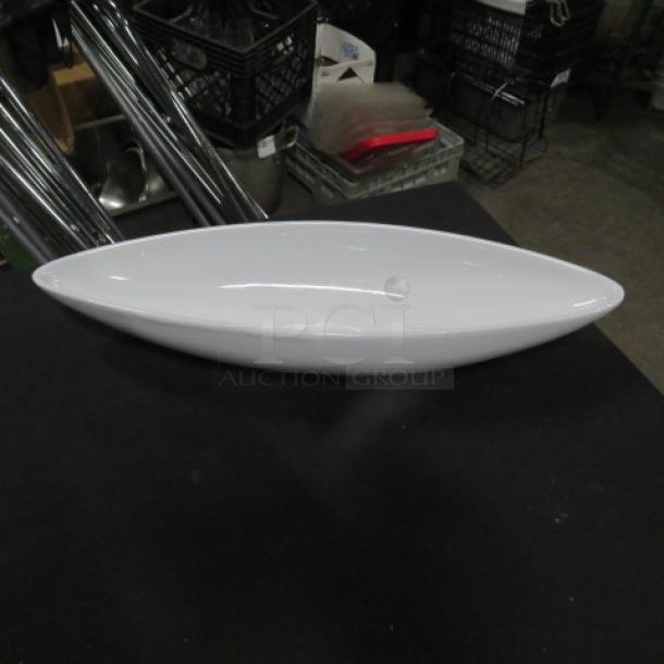 Maison Blanc serving dish, 15x4.5 inches, sleek white ceramic, excellent condition, tag 4XBID, unique oval design.