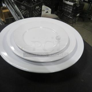 One lot of CORE dishes: 7-9 inch plates, 12-7 inch plates, 10-6 inch plates; white; stacked view; excellent condition.
