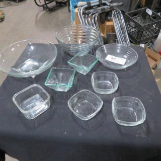 Assorted glassware lot with various bowls and dishes. Includes round and square shapes. Good condition, transparent glass.