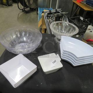 Assorted poly serving dishes, including clear ribbed bowls and white square plates. Condition: Good. Auction lot tag: 100.