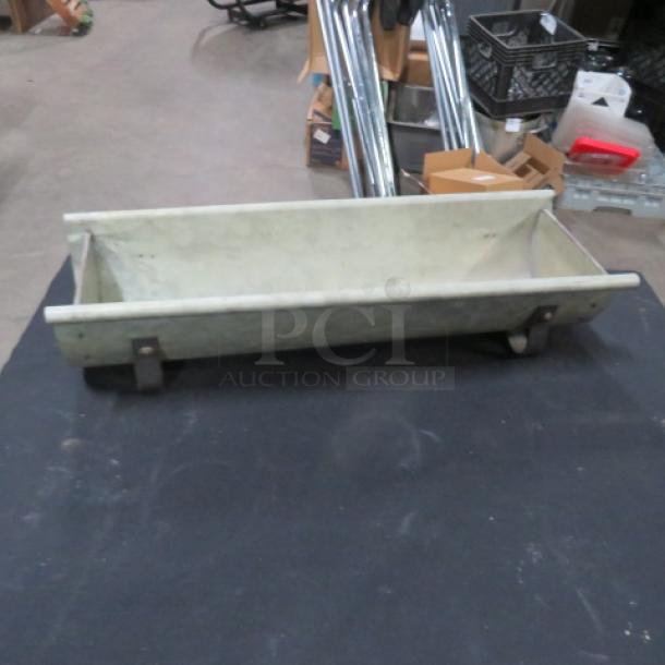Decorative tin holder, vintage style, rectangular shape with metal supports, showing slight wear, suitable for display.