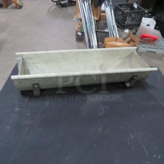 Decorative tin holder, vintage style, rectangular shape with metal supports, showing slight wear, suitable for display.