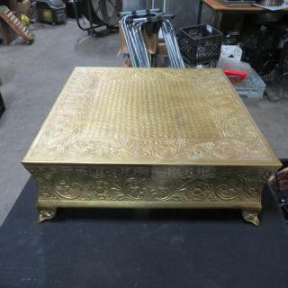 Antique-style 18x18x7 decorative square stand with ornate floral engravings, gold-toned finish, and four carved legs.