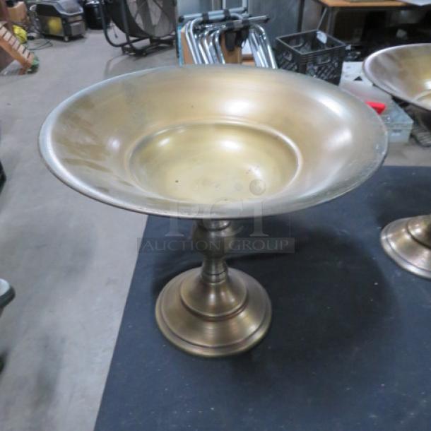 Brass decorative holder on pedestal base, large basin, lightly scratched, suitable for centerpieces or displays.