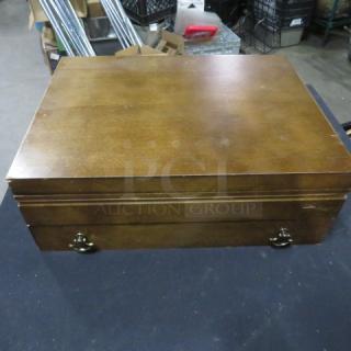Wooden flatware box with one drawer, featuring vintage flatware. Sturdy, polished finish with metal handle accents.
