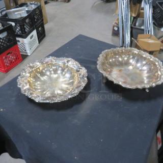 11-inch round silver plate bowls with ornate edges, set of two; reflective surface shows mild tarnish, no visible markings.