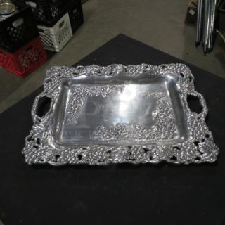 Ornate silver platter with intricate leaf and vine design, 18.5x13.5 inches, excellent condition, decorative edge, and handles.