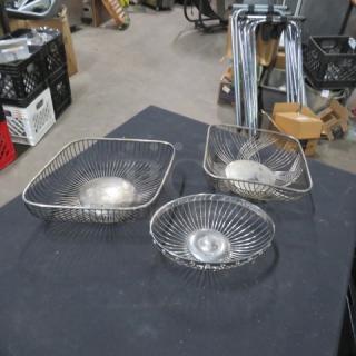 Set of three metal wire baskets, varying shapes and sizes, silver tone, used condition, model 3XBID.