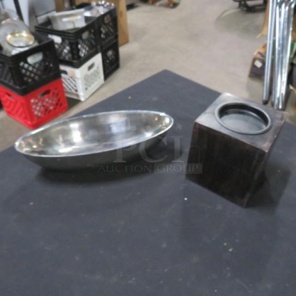 Assorted server set with a silver oval tray and a wooden square base. Good condition, suitable for dining use.