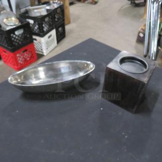 Assorted server set with a silver oval tray and a wooden square base. Good condition, suitable for dining use.