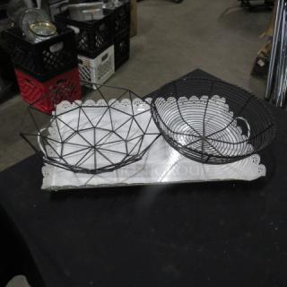 Assorted server set; includes wire baskets and metal serving tray. Good condition, intricate lace-like edge design.