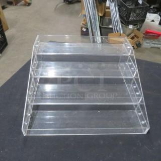 4-tier poly shelf with a side crack, transparent design, used condition, ideal for display storage. 2XBID label visible.