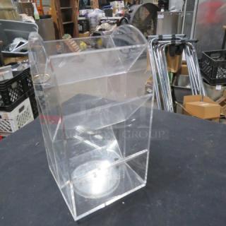 Clear acrylic poly holder with three compartments. Slight scratches visible, suitable for organizing documents or brochures.